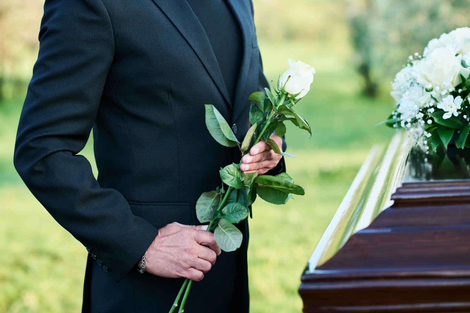 Man with crossed hands - Organising A Funeral 